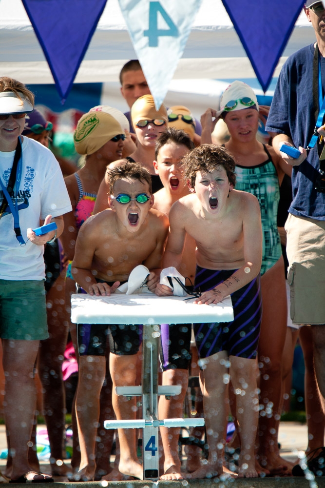 relay team cheering at start blocks